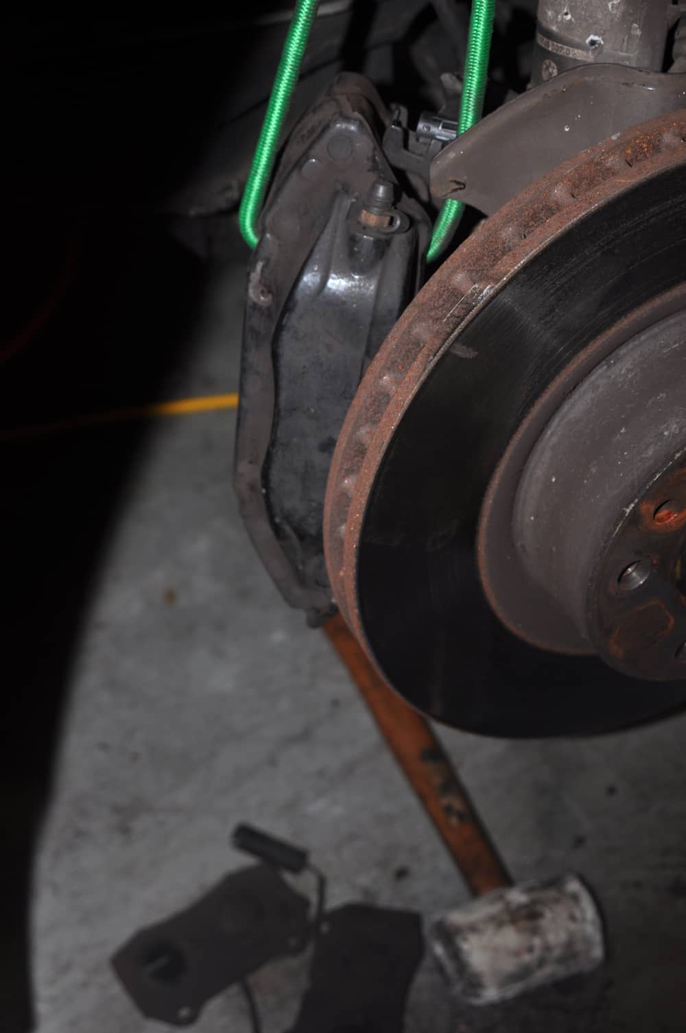 Use a bungee cord to support caliper