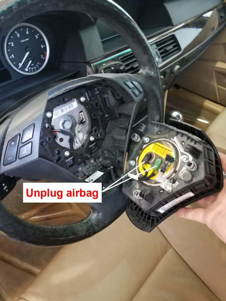 bmw e60 steering angle sensor repair - unplug the airbag