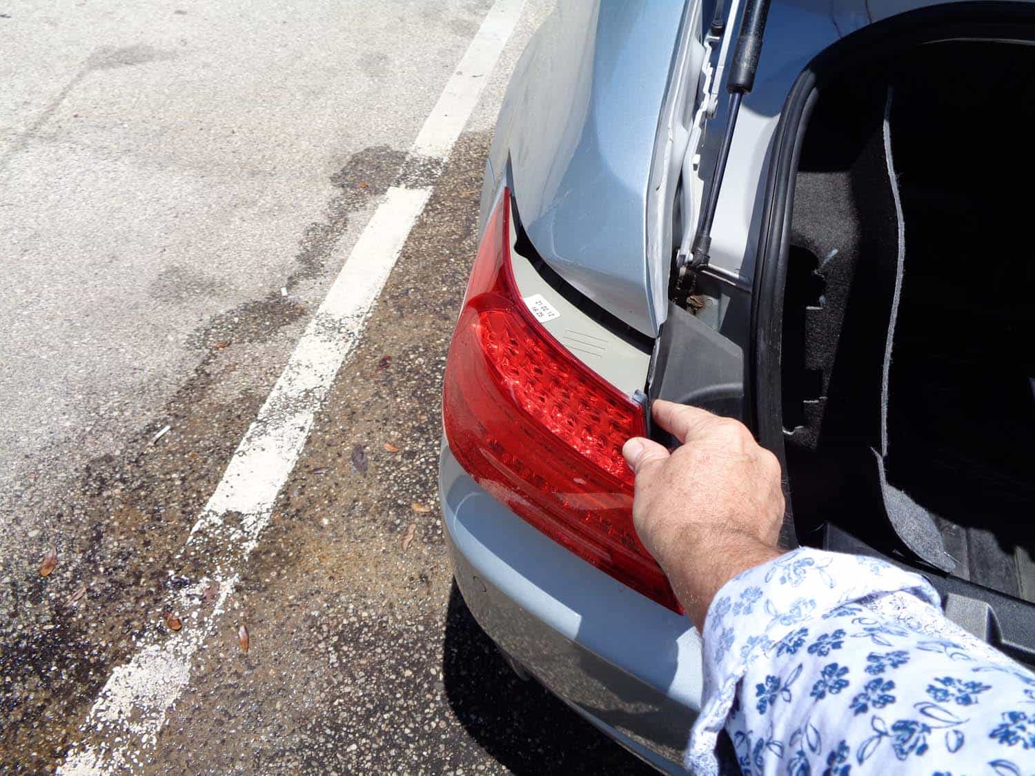 BMW E90 Trunk Leak - remove the tail light from vehicle