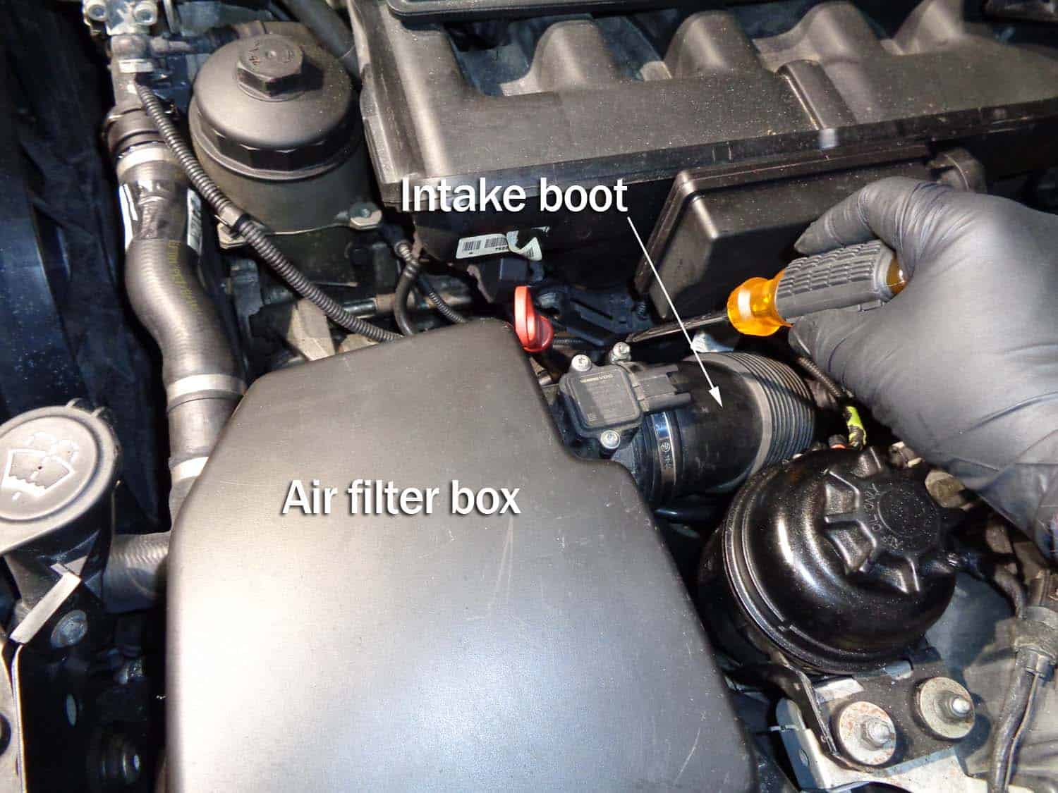 bmw e60 intake boot repair - loosen the hose clamp connecting boot to airbox