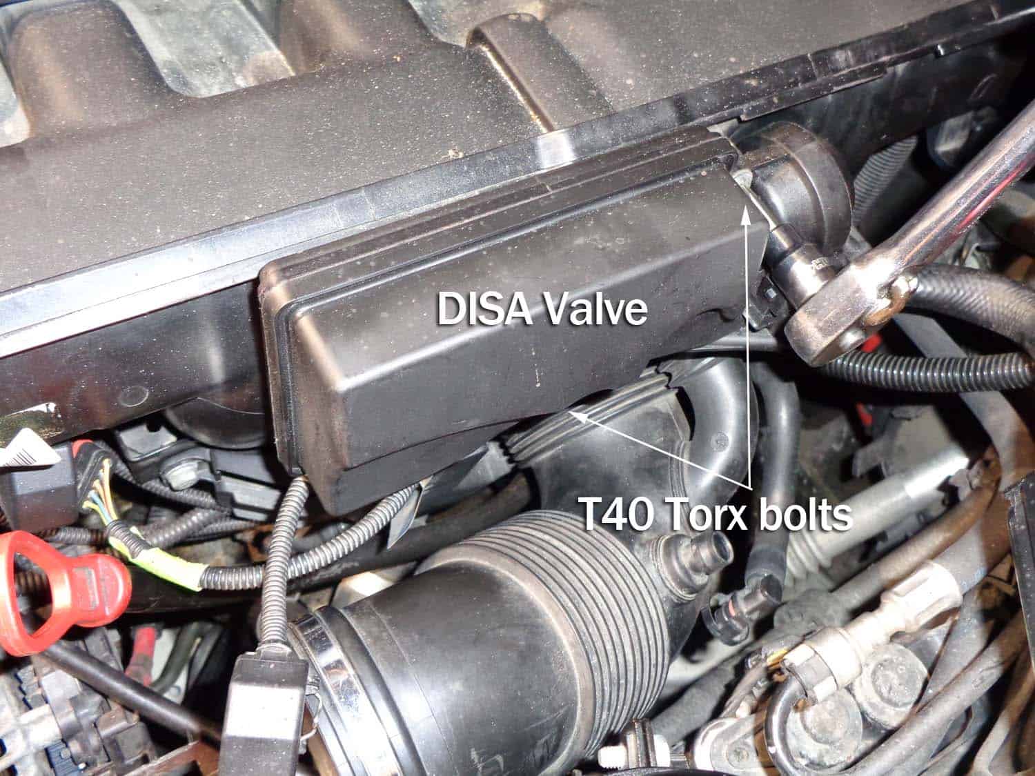 bmw e60 intake boot repair - remove the DISA valve mounting bolts