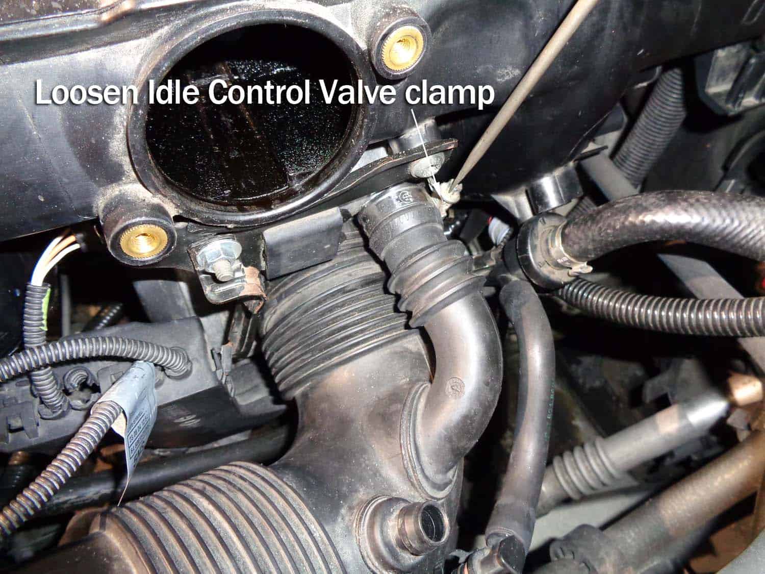 bmw e60 intake boot repair - loosen the idle control hose clamp