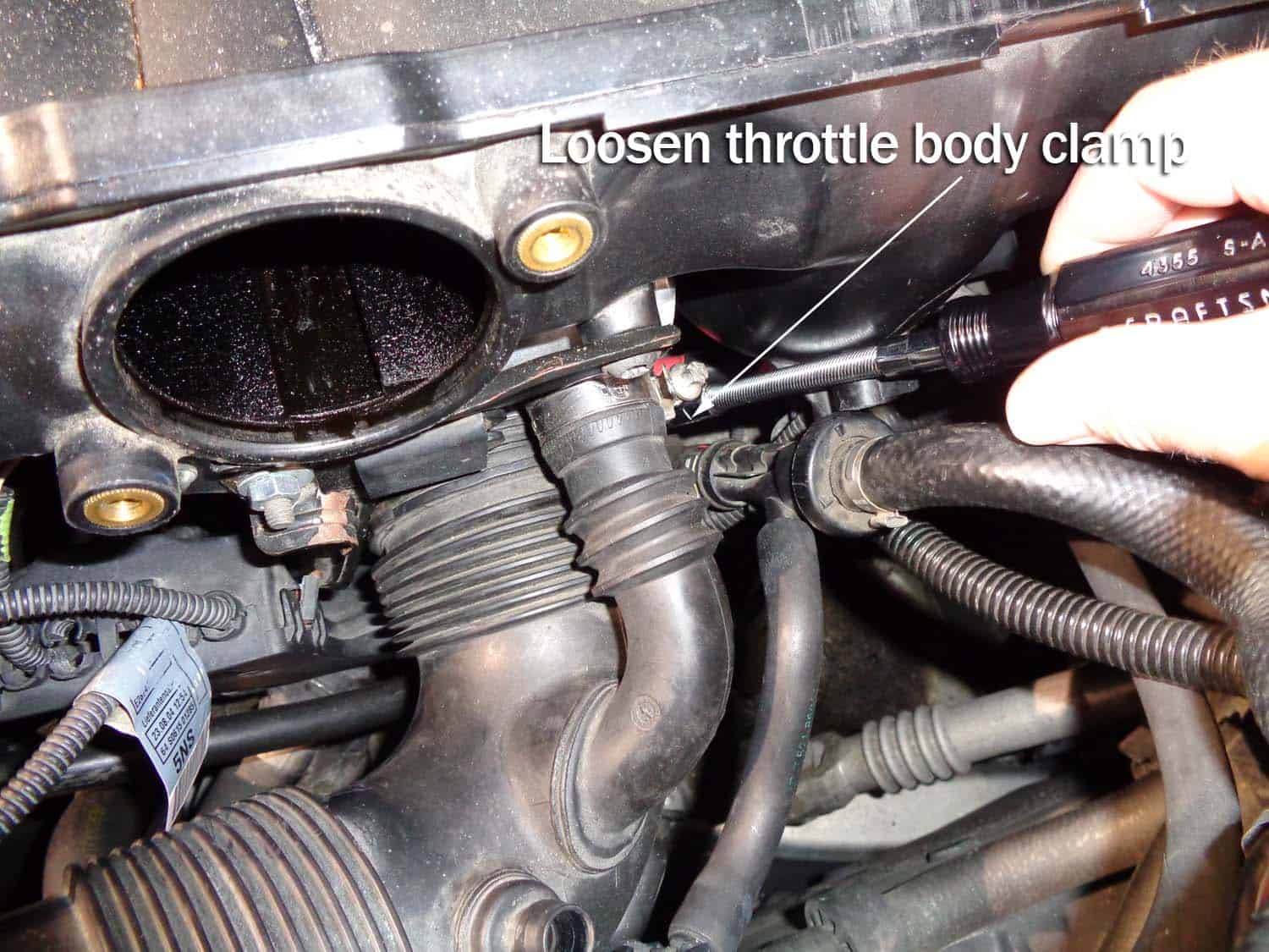 Loosen the throttle bode hose clamp