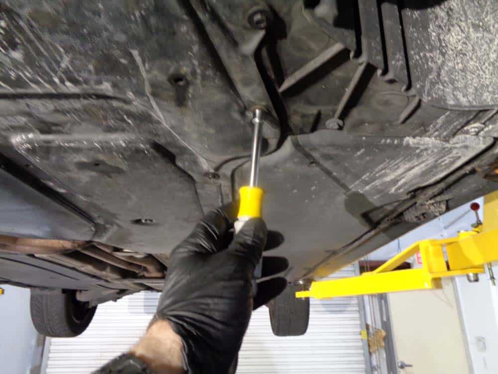 Use an 8mm nut driver to remove the pan