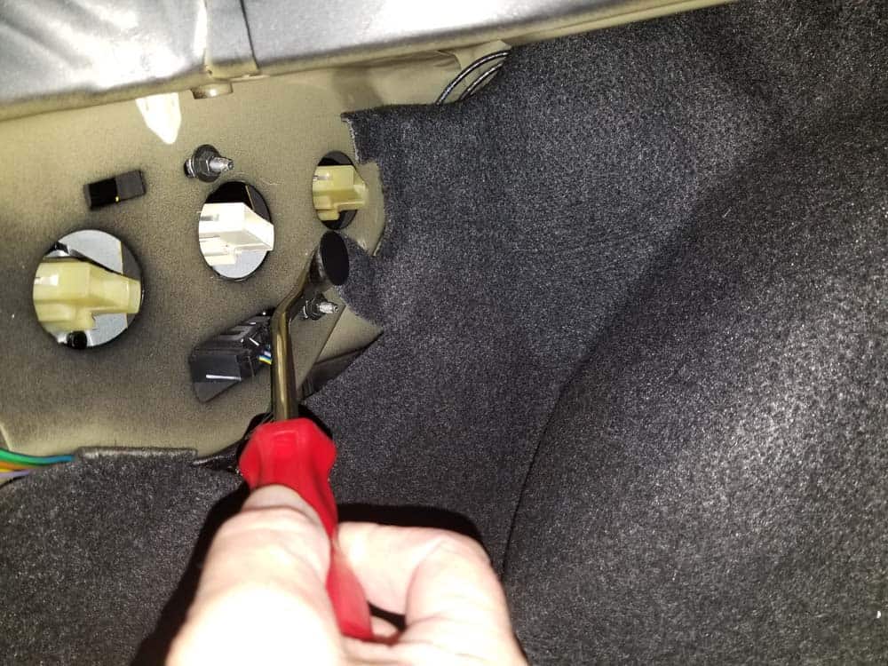 BMW E85 rear shock replacement - remove the plastic rivet