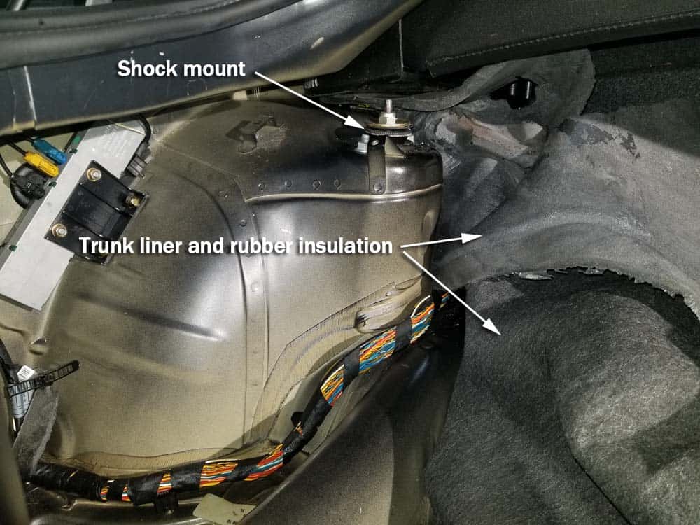 BMW E85 rear shock replacement - pull the sound insulation back