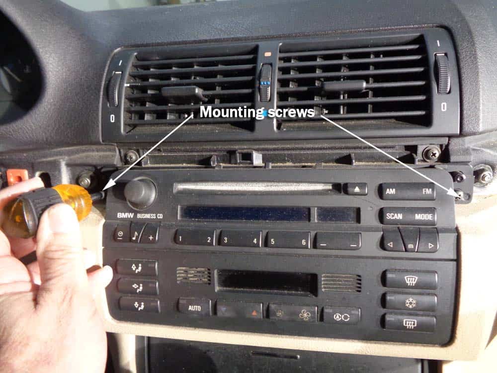 BMW E46 radio removal - remove the two radio mounting screws