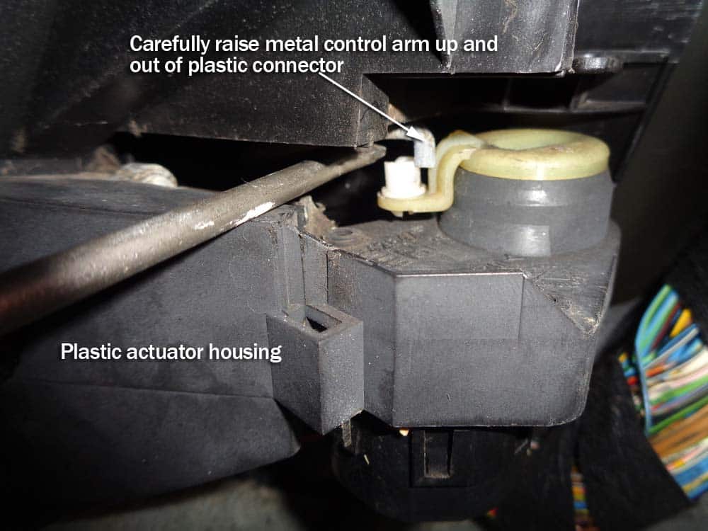 Raise the metal control arm out of the actuator housing