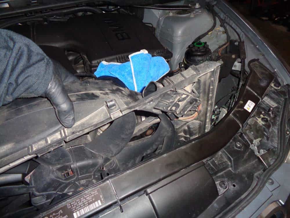 BMW E90 cooling fan - pull the fan assembly out of the vehicle.