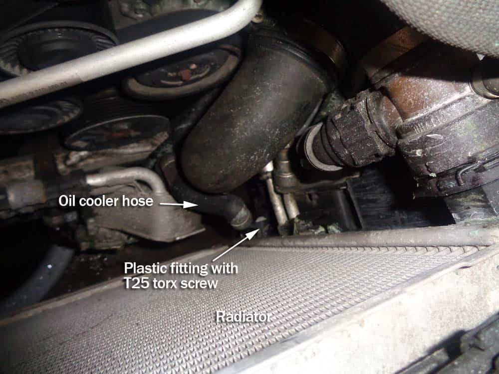 BMW E90 radiator - remove the oil cooler hose from bottom of the radiator