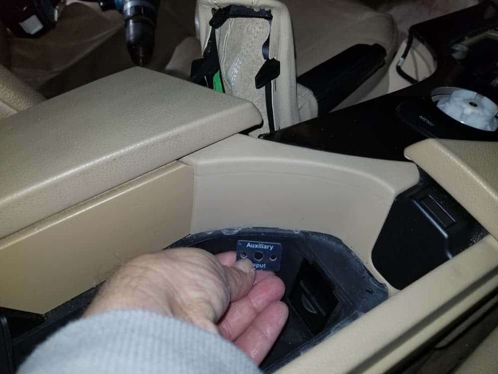 bmw auxiliary port - Locate where you want to mount the auxiliary port in the center console storage compartment