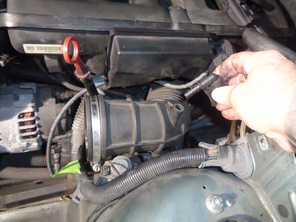 Remove the vacuum line from the intake boot.