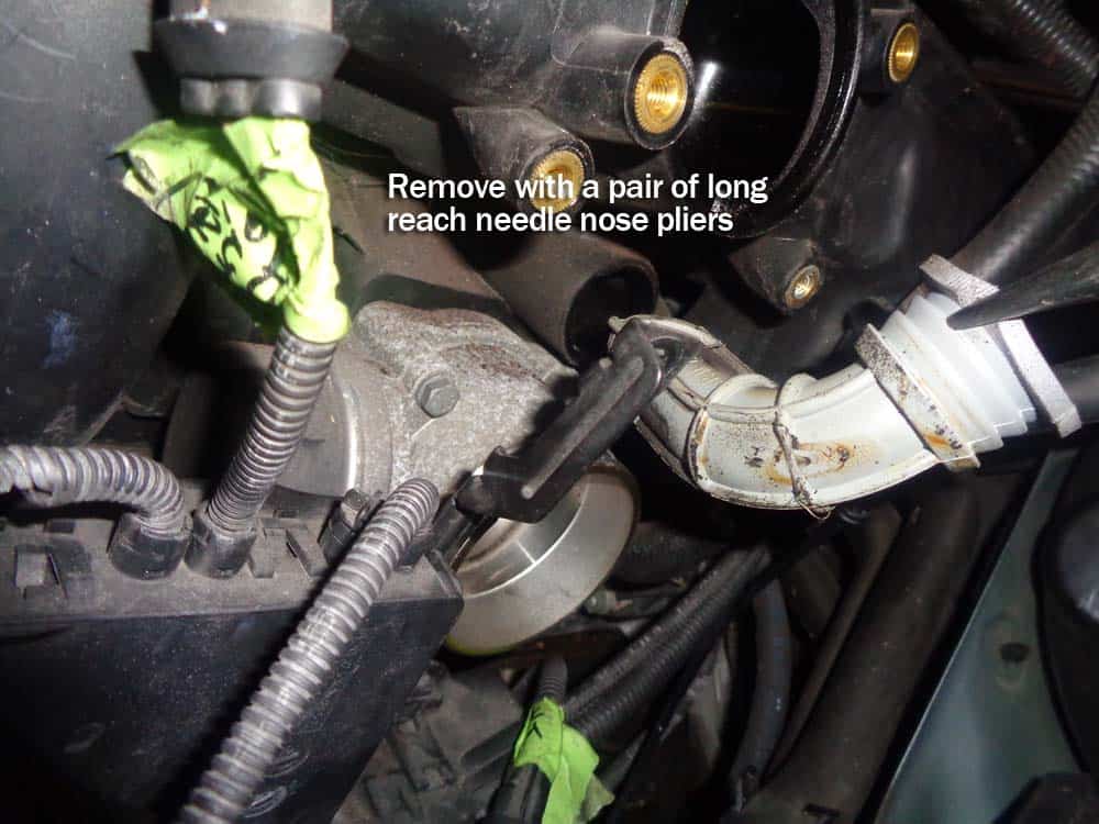 Pull the grommet from the intake manifold.