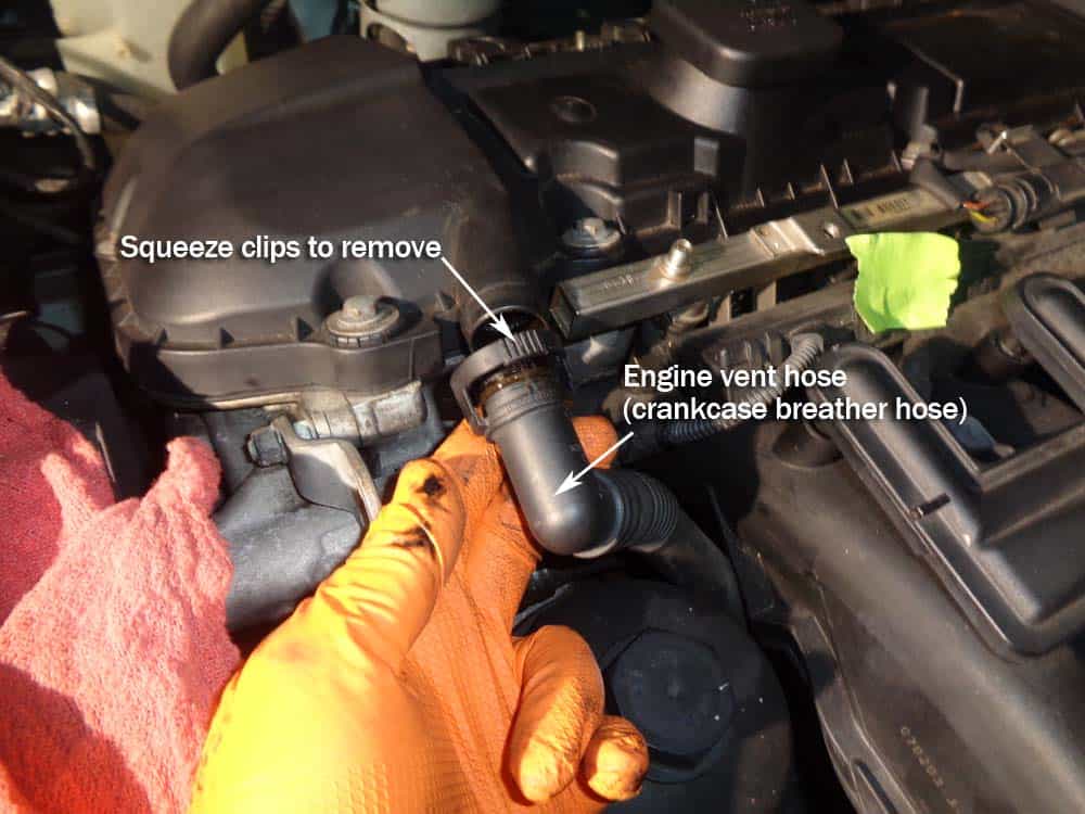 BMW E46 intake manifold - remove the crankcase breather hose.
