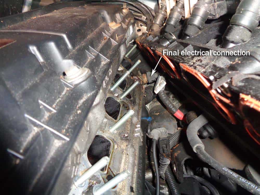 BMW E46 intake manifold - locate the final electrical connection near the fire wall.