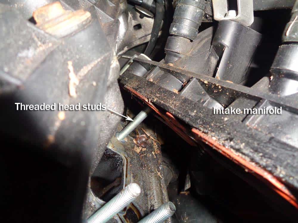Pull the intake manifold loose from the threaded studs.