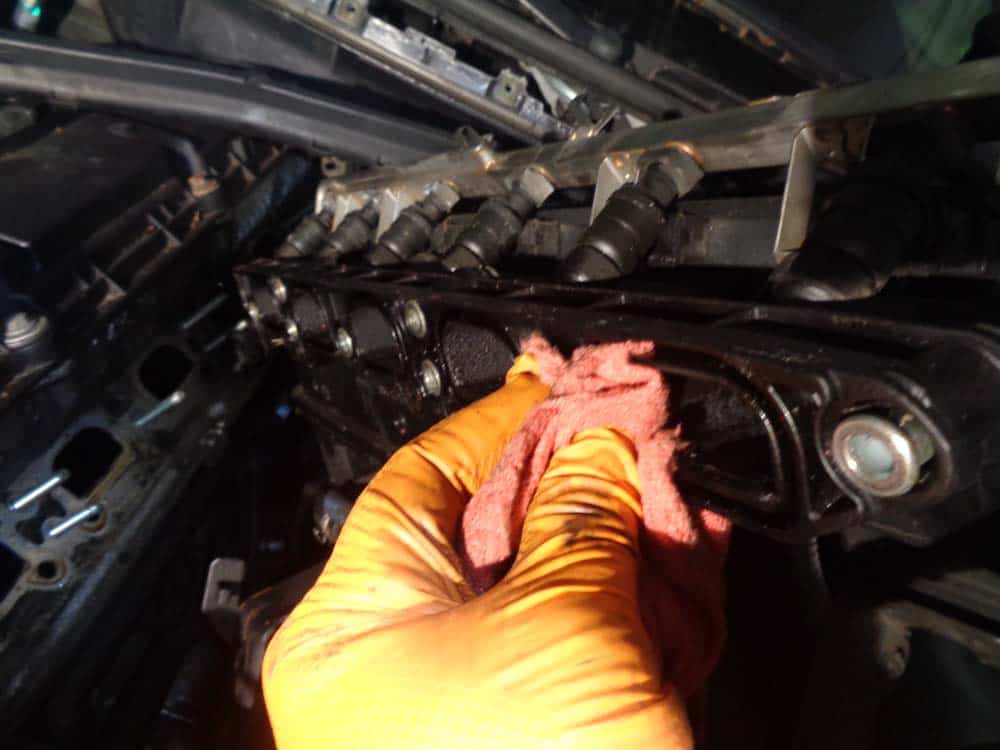 BMW E46 intake manifold - Clean the intake manifold with a rag.