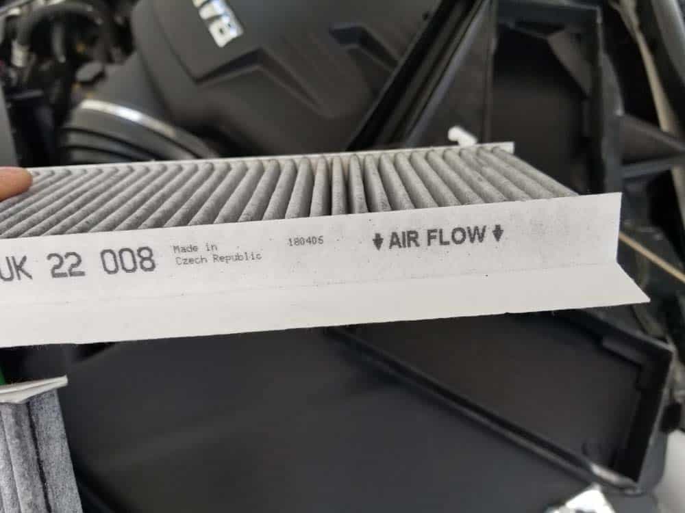 BMW E9x M3 cabin filter replacement - Note the air flow direction on the side of the cabin filter