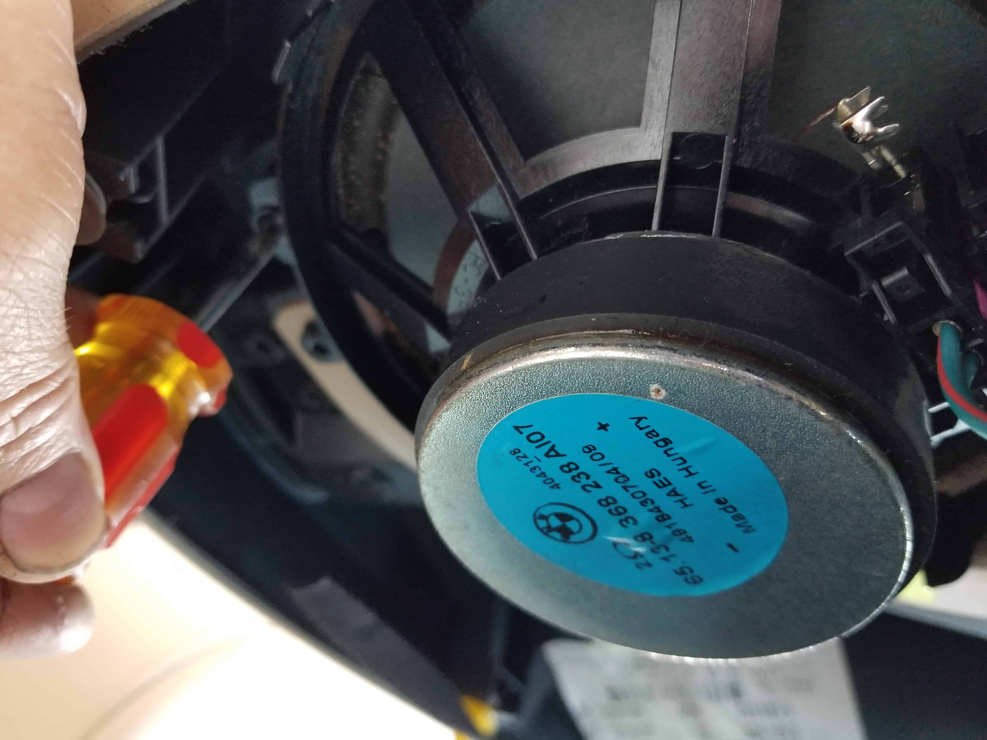 BMW E46 door speaker repair - remove the speaker mounting bolts.