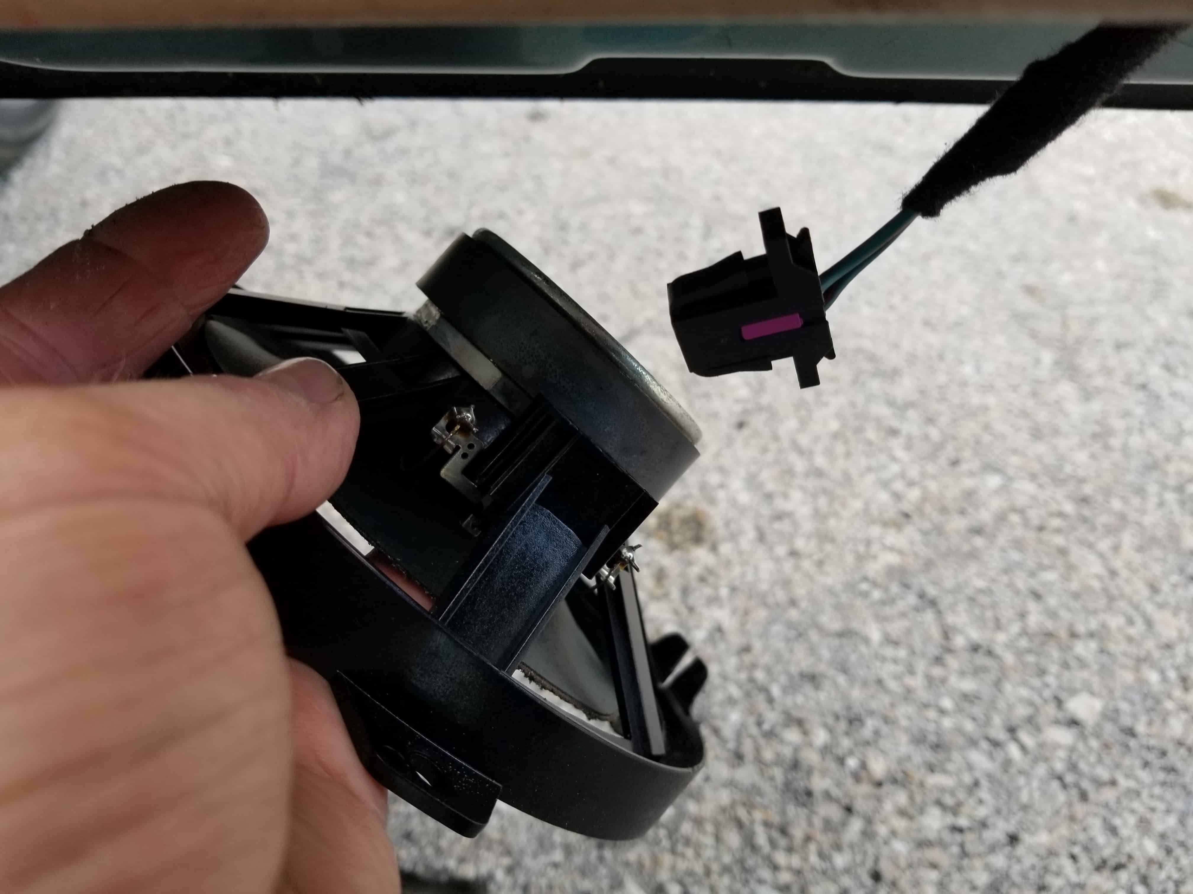 BMW E46 door speaker repair - unplug the speaker from the door panel.