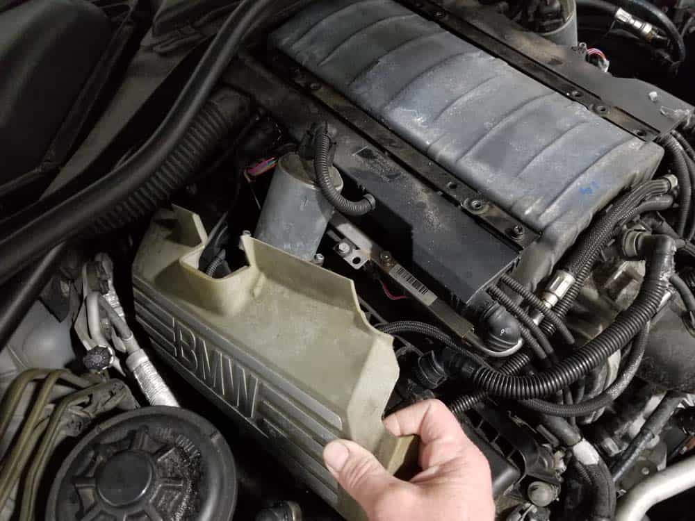 Remove the side covers from the engine