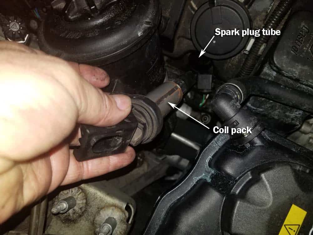 BMW N62 engine tune up - Remove the ignition coil from the spark plug.