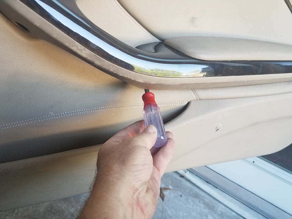 BMW E46 door speaker repair - remove the center torx screw.