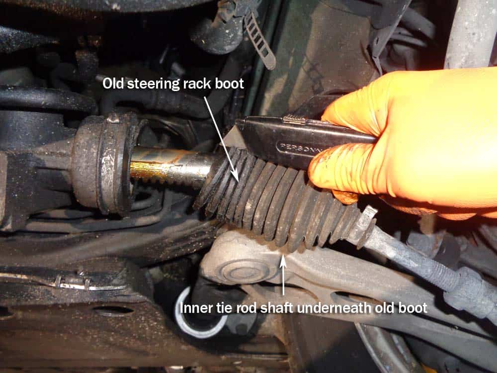 BMW E46 Tie Rod Repair - Use a utility knife to cut off the old steering rack boot.