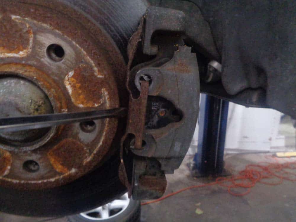 BMW E46 Brake Repair - remove the anti-rattle clip from the caliper