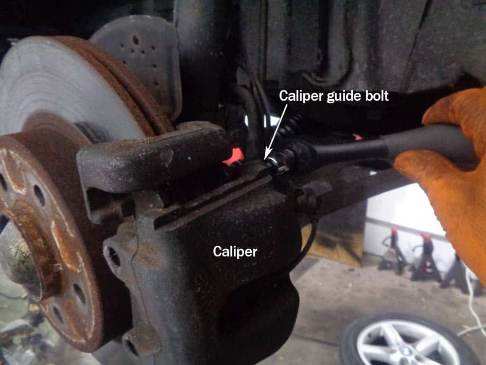 Remove the caliper guide bolts