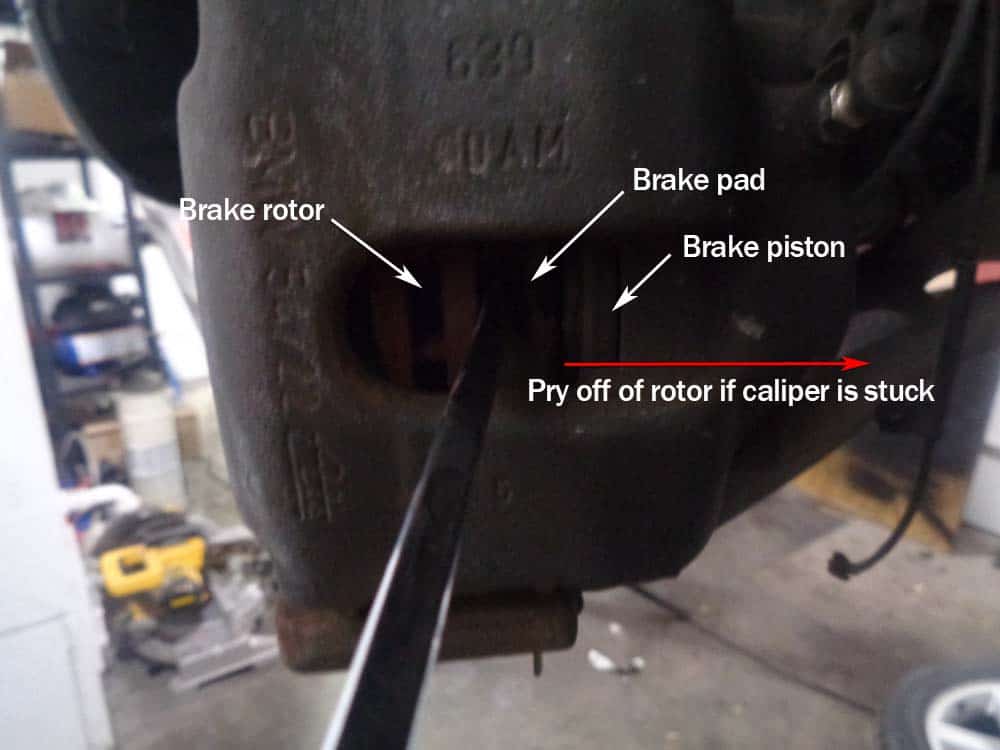 BMW E46 Brake Repair - use a screwdriver to pry the brake piston closed if caliper is stuck