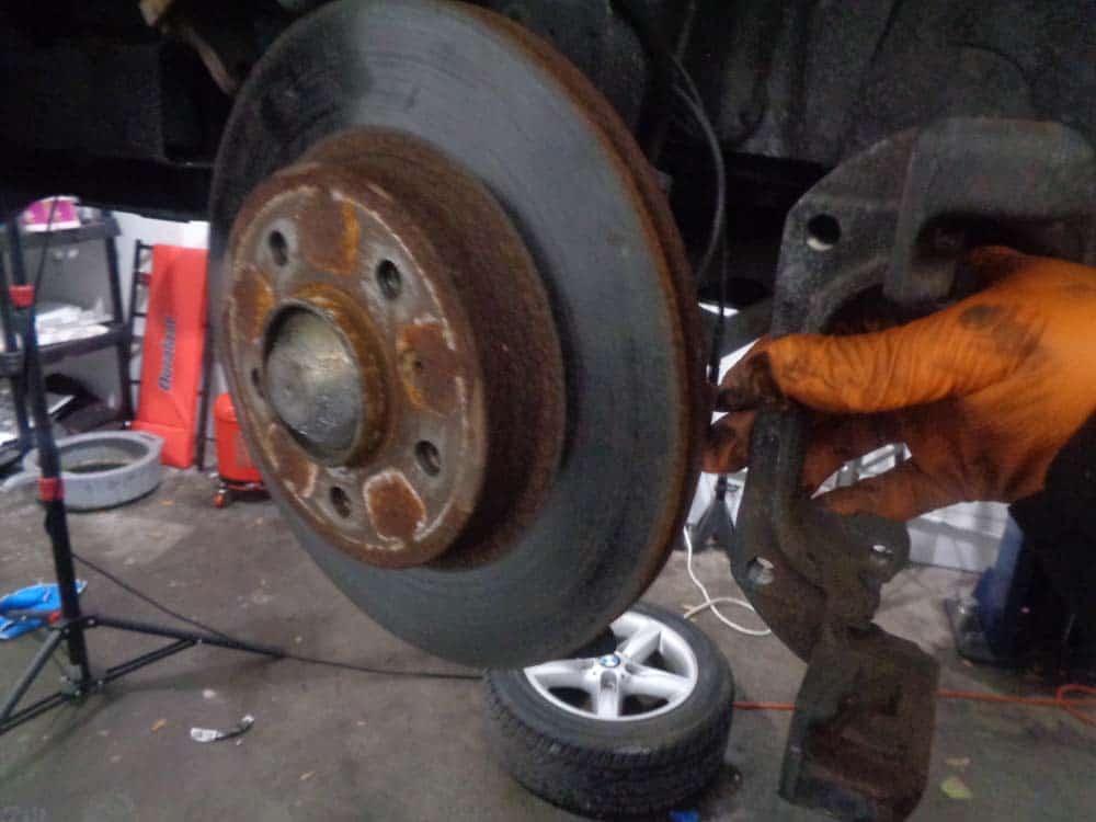 BMW E46 Brake Repair - remove the caliper carrier from the wheel.