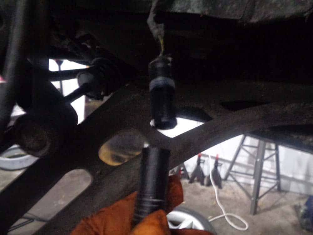 Unplug the brake pad wear sensor.