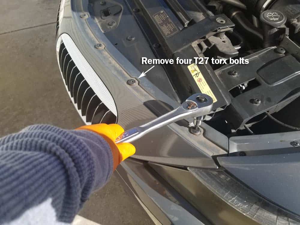 bmw 645ci grille replacement - Remove the T27 torx bolts anchoring the top of the bumper.