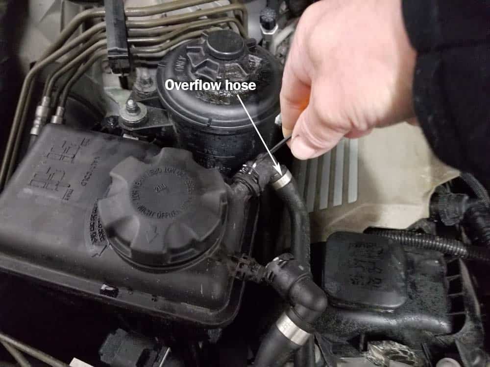 bmw coolant expansion tank replacement - Remove the overflow hose on eight cylinder models.