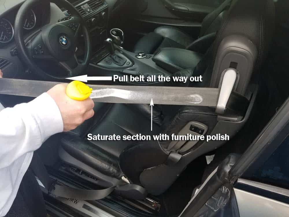 bmw seat belt repair - pull the seat belt all the way out and saturate with furniture polish