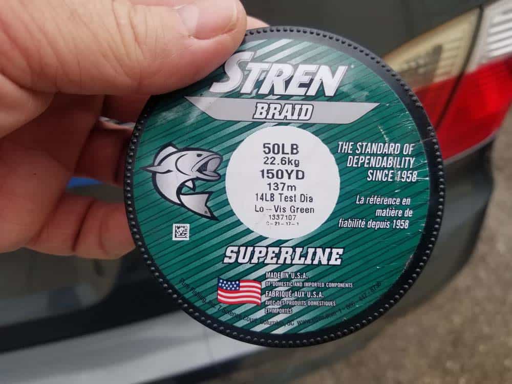 Braided fishing line for removing old emblem