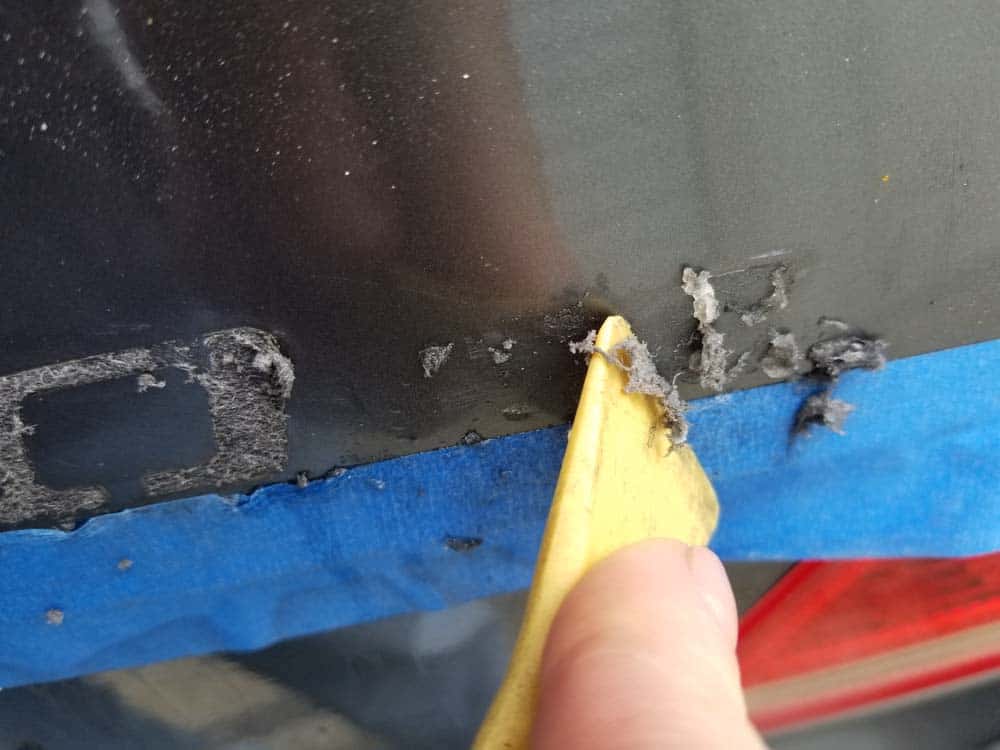 BMW Trunk Emblem Replacement - scrape off old glue and foam