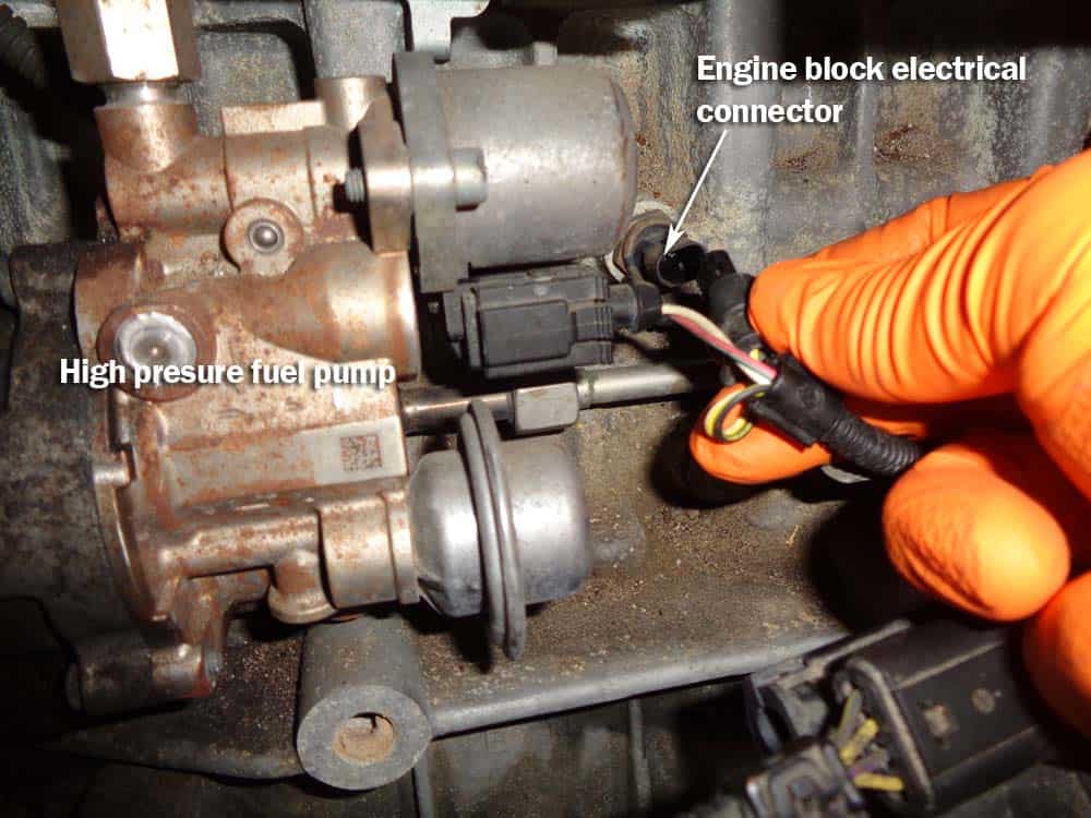 bmw high pressure fuel pump - Disconnect the engine block electrical connection behind the fuel pump.