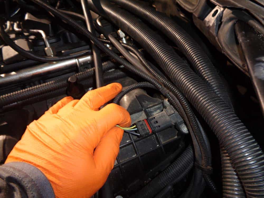 Disconnect the sensor from the rear of the intake manifold.