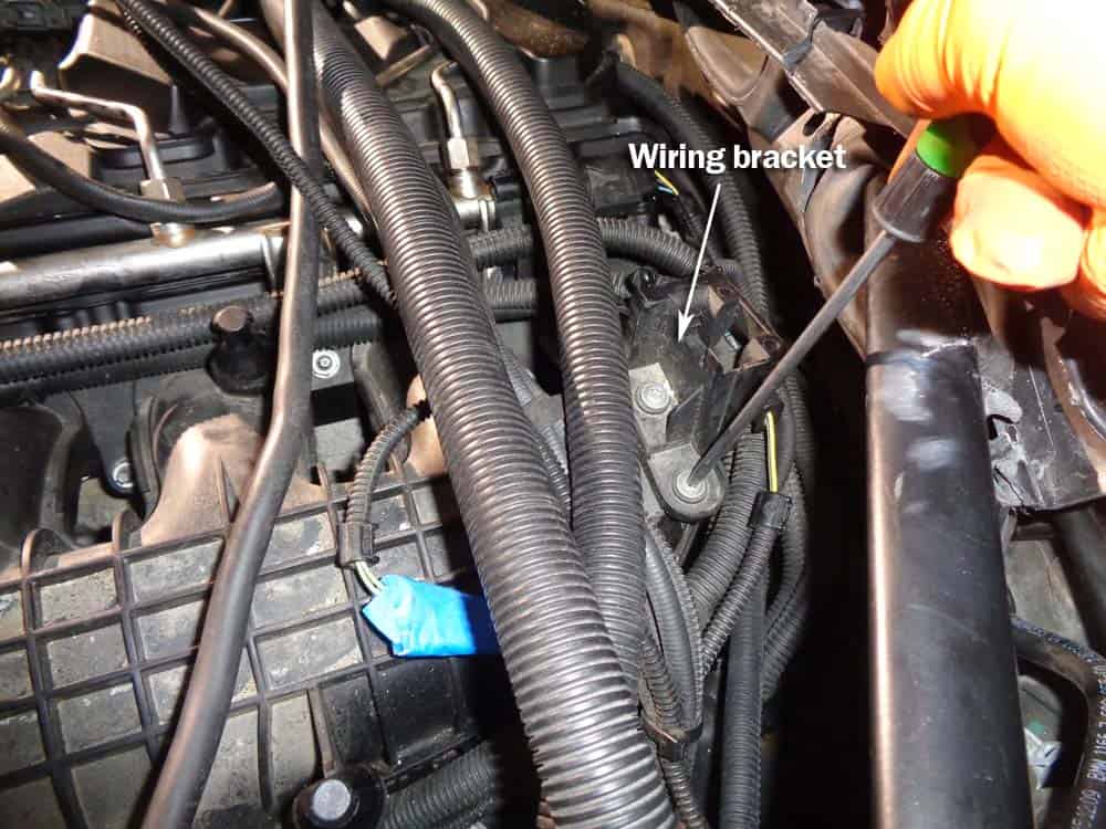 bmw high pressure fuel pump - Use a T25 torx bit to remove the wiring harness bracket