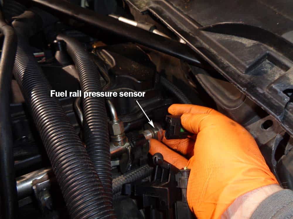 Disconnect electrical connection from fuel rail pressure sensor.