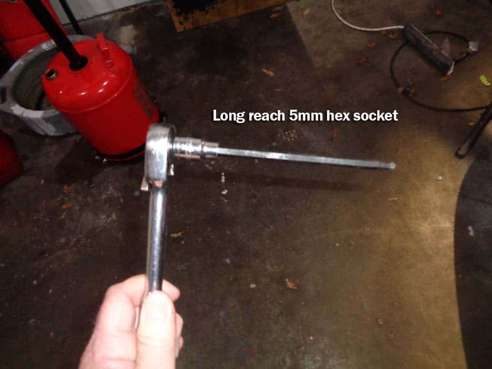 You must use a long reach 5mm hex socket to reach the fuel pump bolts.