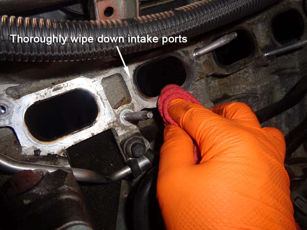 Thoroughly wipe down the intake ports in the cylinder head