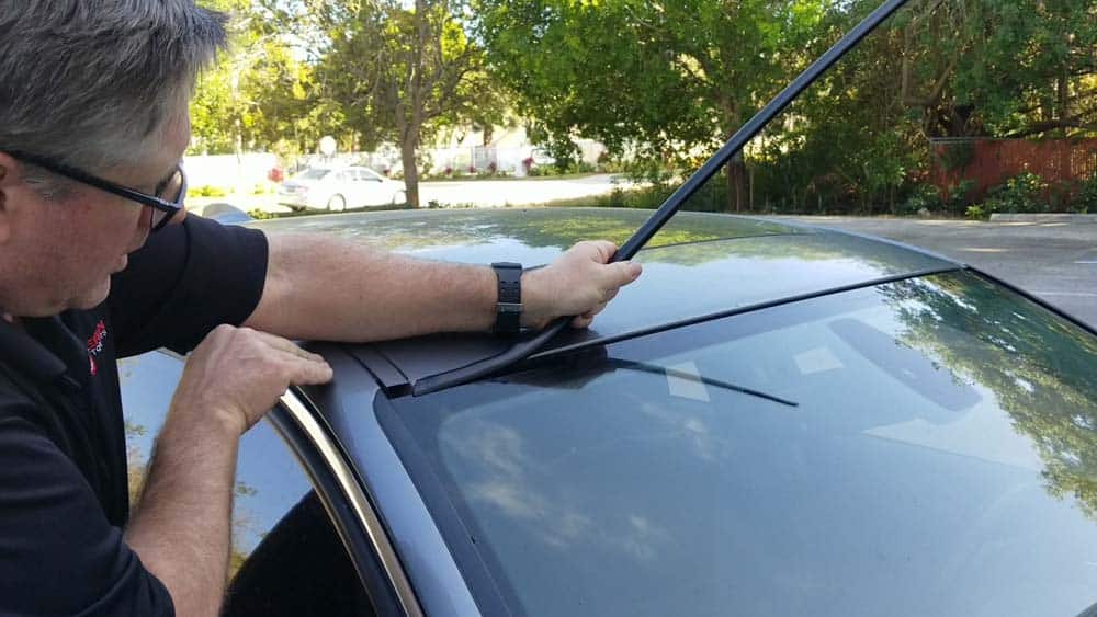 bmw windshield moulding replacement - Starting on one side of the vehicle, slide the moulding onto the windshield 