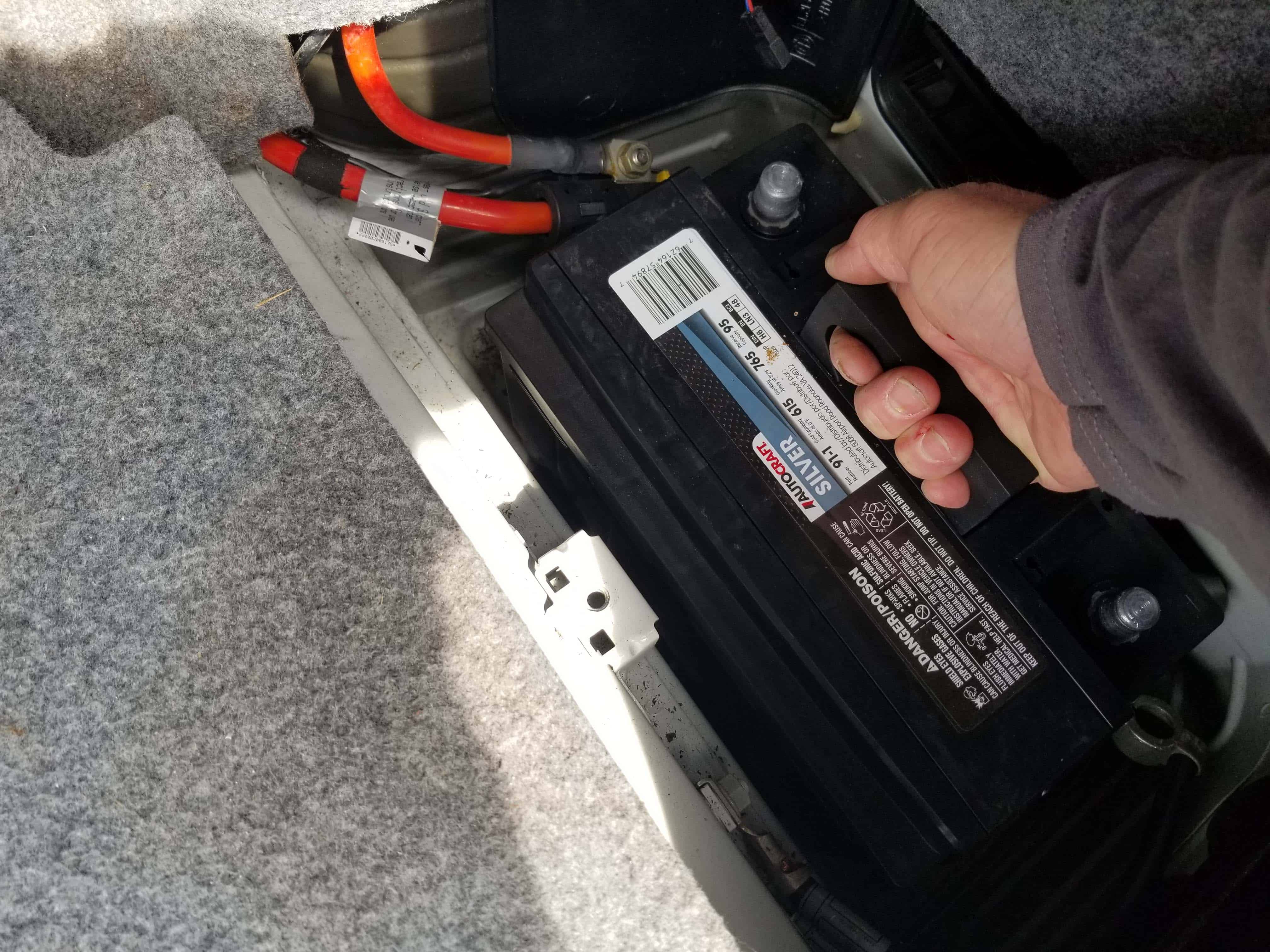 bmw e46 battery replacement - Grasp the battery and remove from the vehicle