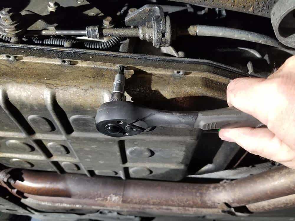 BMW 5HP19 solenoid replacement - Use a T27 torx bit to remove the transmission pan mounting bolts.