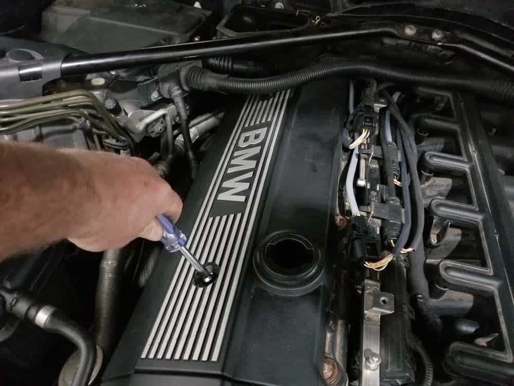 BMW E60 Tune Up - Use a 10mm socket wrench to remove the right engine cover