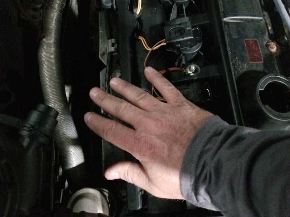BMW E60 Tune Up - Use the palm of your hand to press the ignition coil down