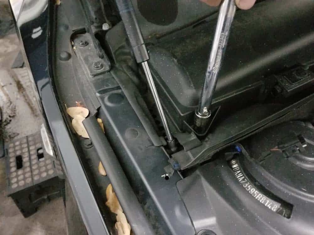 BMW E60 Tune Up - Release the cabin filter container with a 13mm socket